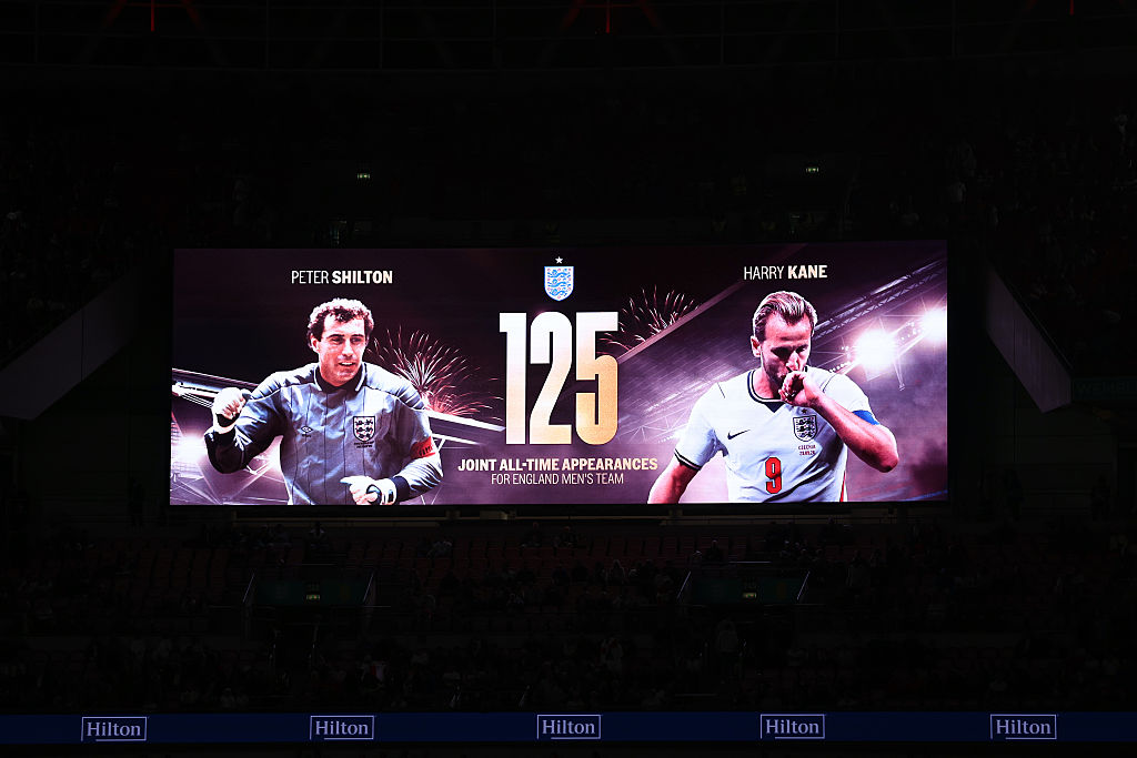 A screen at Wembley Stadium shows a graphic marking Harry Kane’s record-equalling 125th England appearance, level with Peter Shilton, in London on October 6, 2026