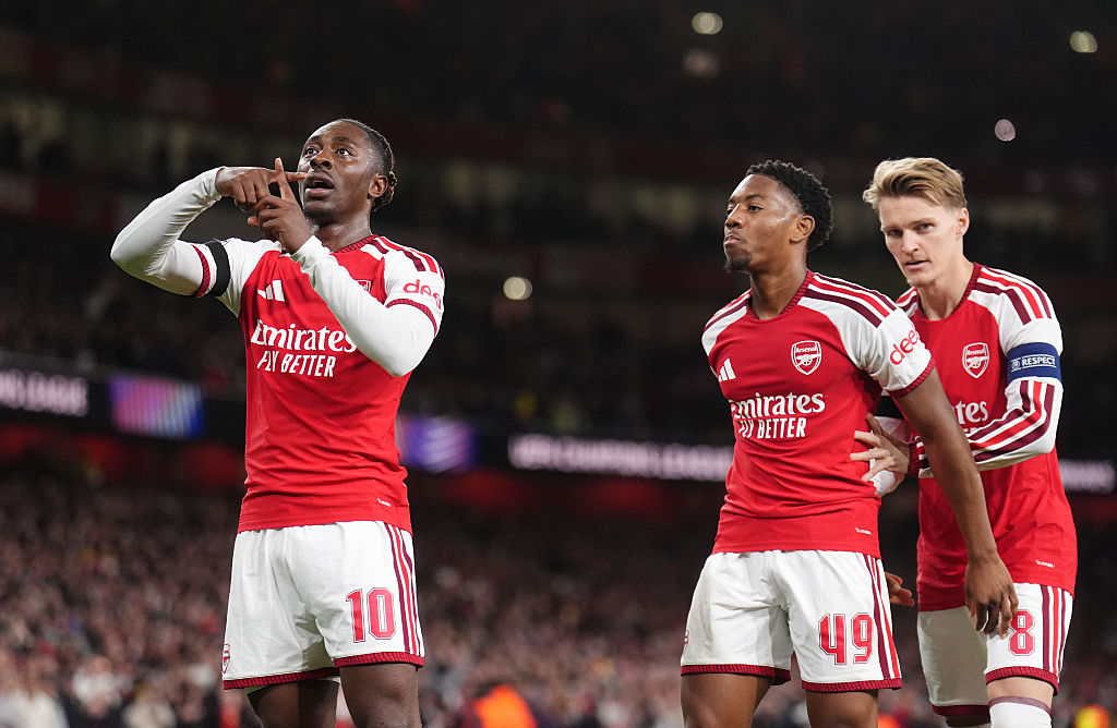 Arsenal's Eberechi Eze (left) celebrates scoring their side's second goal of the game with Myles Lewis-Skelly and Martin Odegaard (right) during the UEFA Champions League