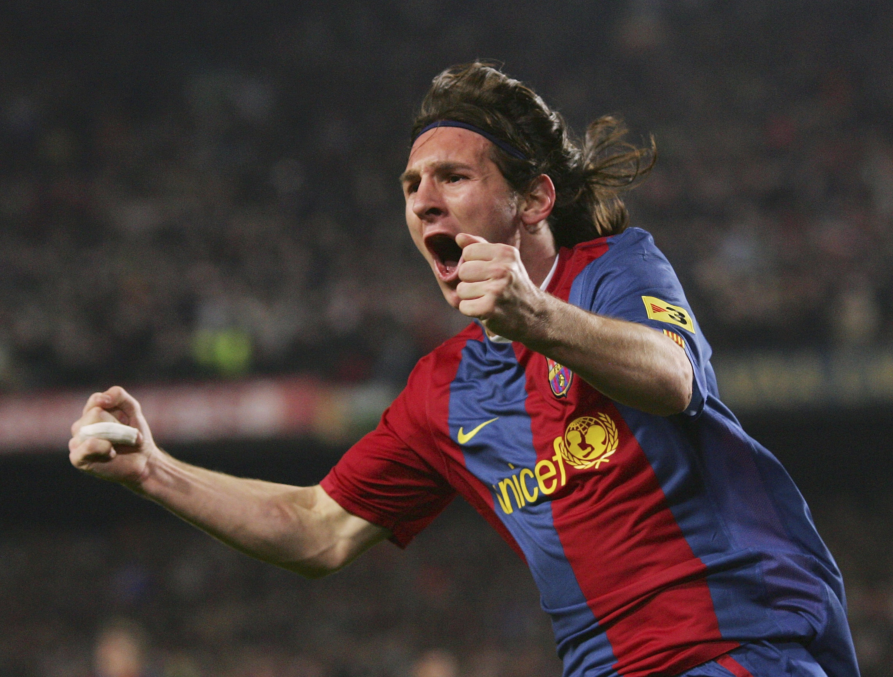 BARCELONA, SPAIN - MARCH 10: Lionel Messi of Barcelona celebrates after scoring their second goal during the Primera Liga match between Barcelona and Real Madrid at the Nou Camp stadium on March 10, 2007 in Barcelona, Spain. (Photo by Denis Doyle/Getty Images)