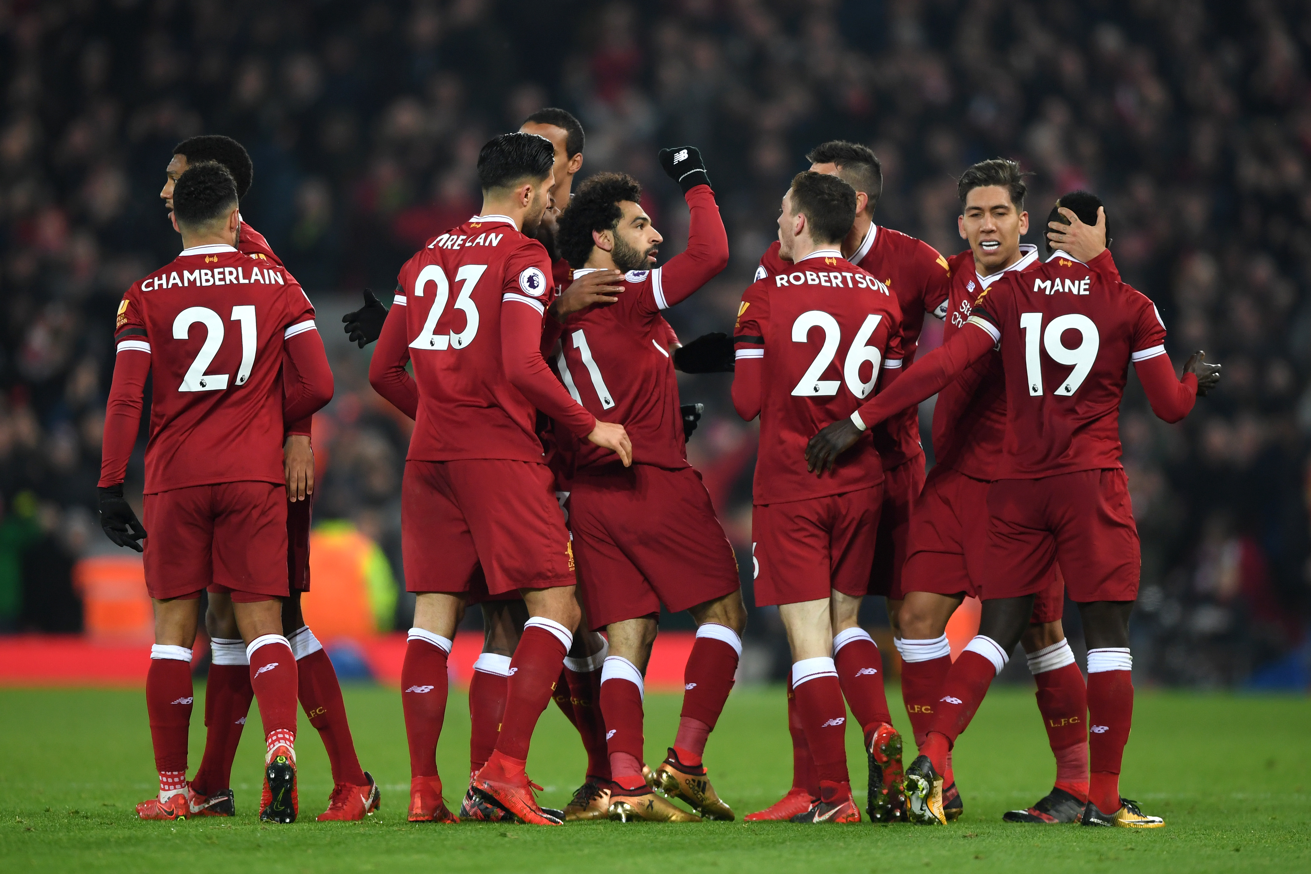 LIVERPOOL, ENGLAND - JANUARY 14: Mohamed Salah of Liverpool celebrates with team mates after scoring the fourth Liverpool goal during the Premier League match between Liverpool and Manchester City at Anfield on January 14, 2018 in Liverpool, England. (Photo by Shaun Botterill/Getty Images)
