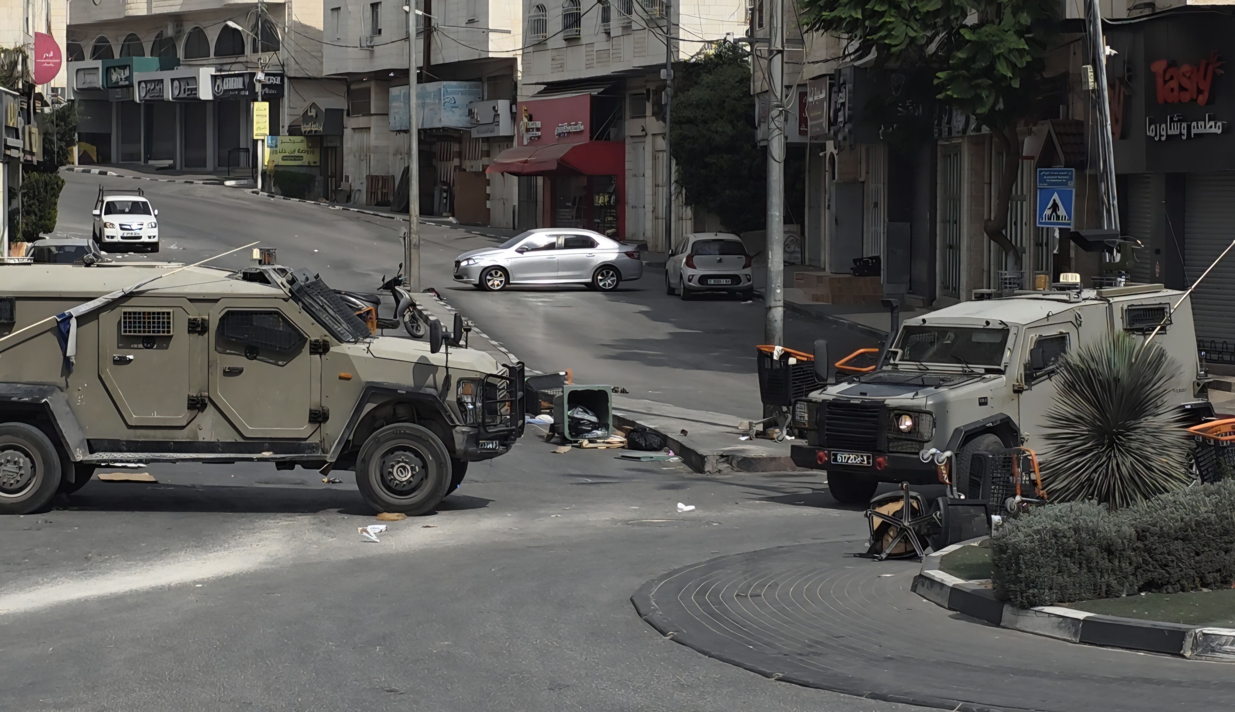 Israeli military vehicles in Hebron, which has been locked down in the wake of an attack on Friday on Israeli soldiers