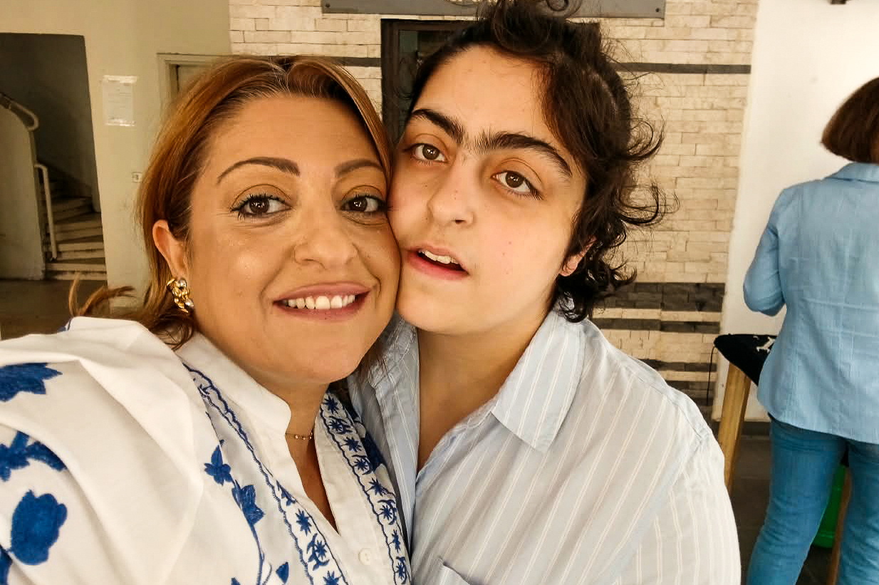 Lena Kouyoumjian poses for a selfie with her non-verbal autistic daugher Vana, whose symptoms have worsened due to Israel’s war in Lebanon, as the 20-year-old fears loud noises or “any sudden change in routine” [Courtesy of Lena Kouyoumjian]