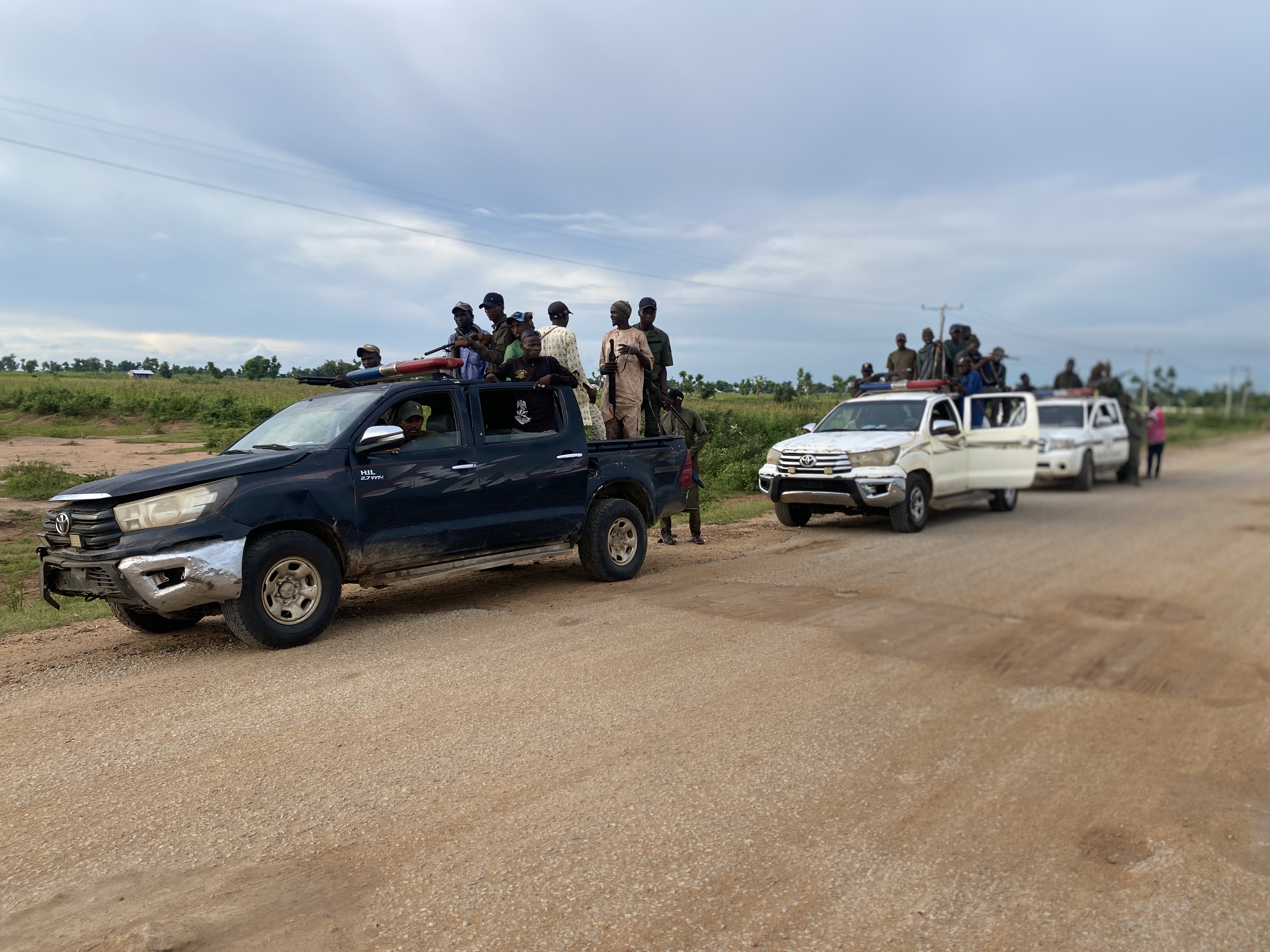 A convoy of Pulaku vigilantes travels through the savanna outside Yola, northeastern Nigeria, on its way to a training exercise