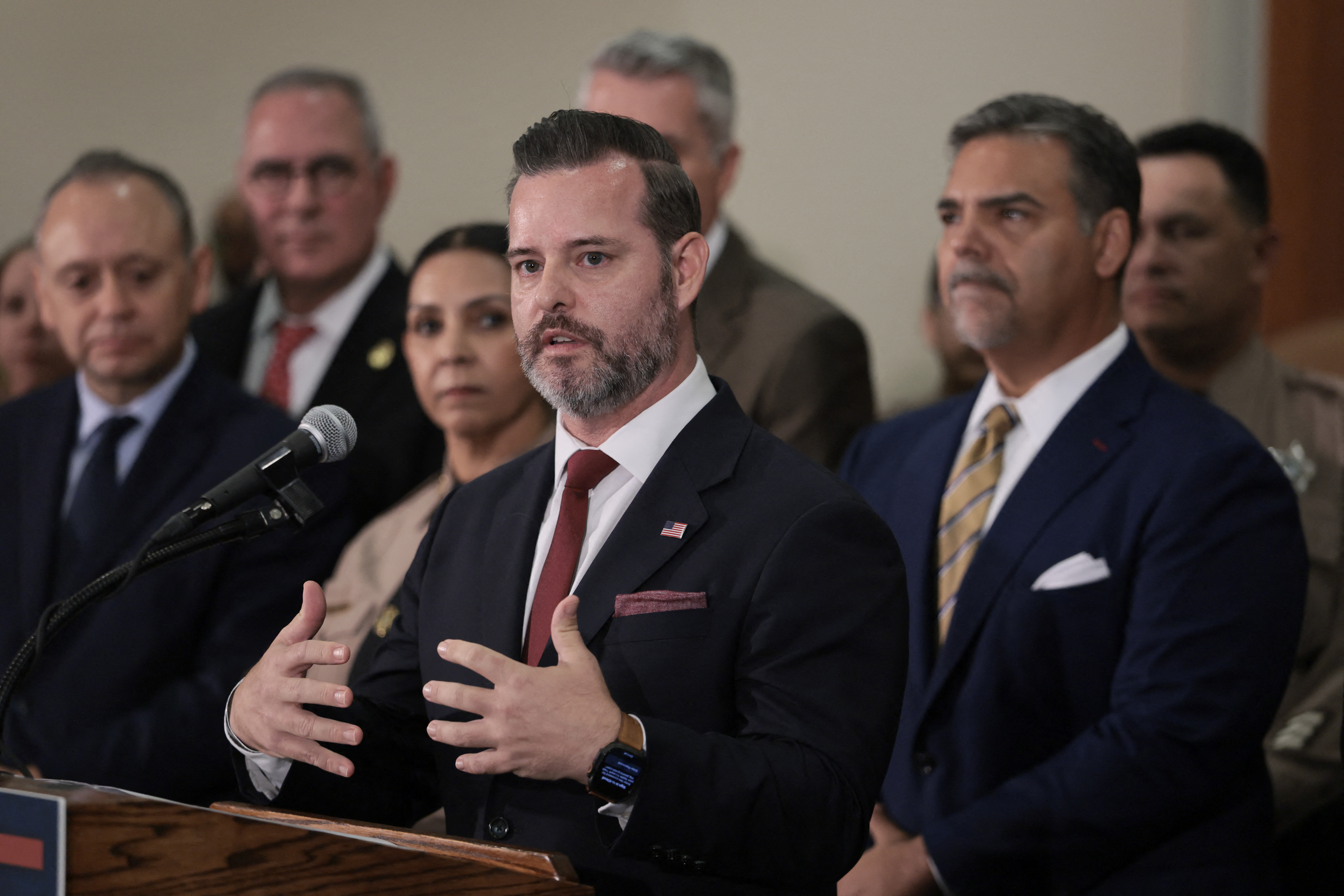 MIAMI, FLORIDA - OCTOBER 19: U.S. Attorney for the Southern District of Florida, Jason Reding Quiñones (R), attends a press conference at Florida International University to announce that former Cuban leader Raúl Castro has been charged with conspiracy to commit first-degree murder on October 19, 2026 in Miami, Florida. A South Florida judge has signed a state arrest warrant for former Cuban leader Raúl Castro and his involvement in the 1996 shootdown of two planes operated by the Miami-based exile group Brothers to the Rescue. Joe Raedle/Getty Images/AFP (Photo by JOE RAEDLE / GETTY IMAGES NORTH AMERICA / Getty Images via AFP)