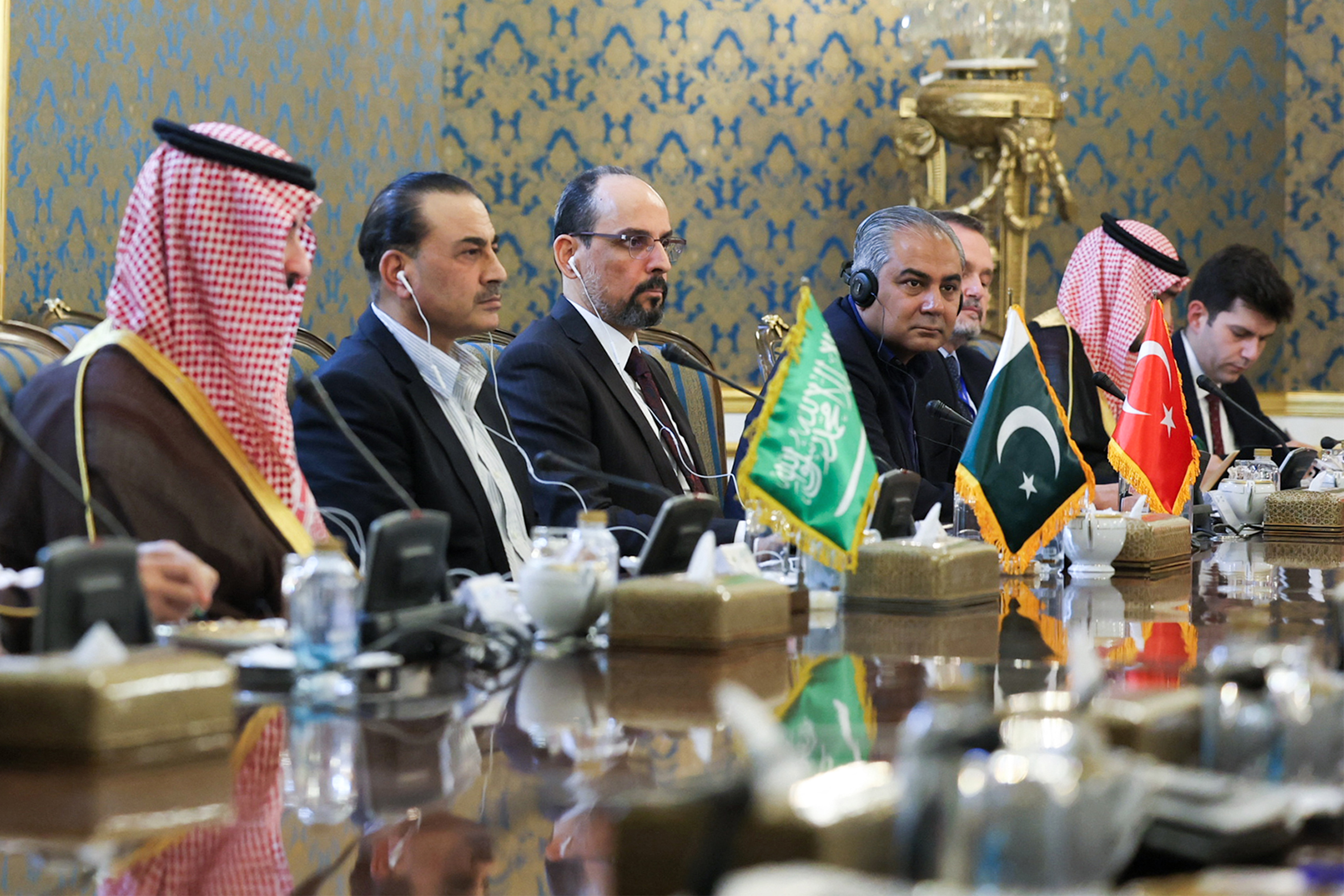 This handout picture provided by the Iranian presidency shows (L to R) Saudi Arabia's Defence Minister Prince Khalid bin Salman Al-Saud, Pakistan's army chief General Syed Asim Munir, and Turkey's intelligence chief Ibrahim Kalin during their meeting with Iran's President, Foreign Minister, and National Security Council head in Tehran on October 26, 2026.