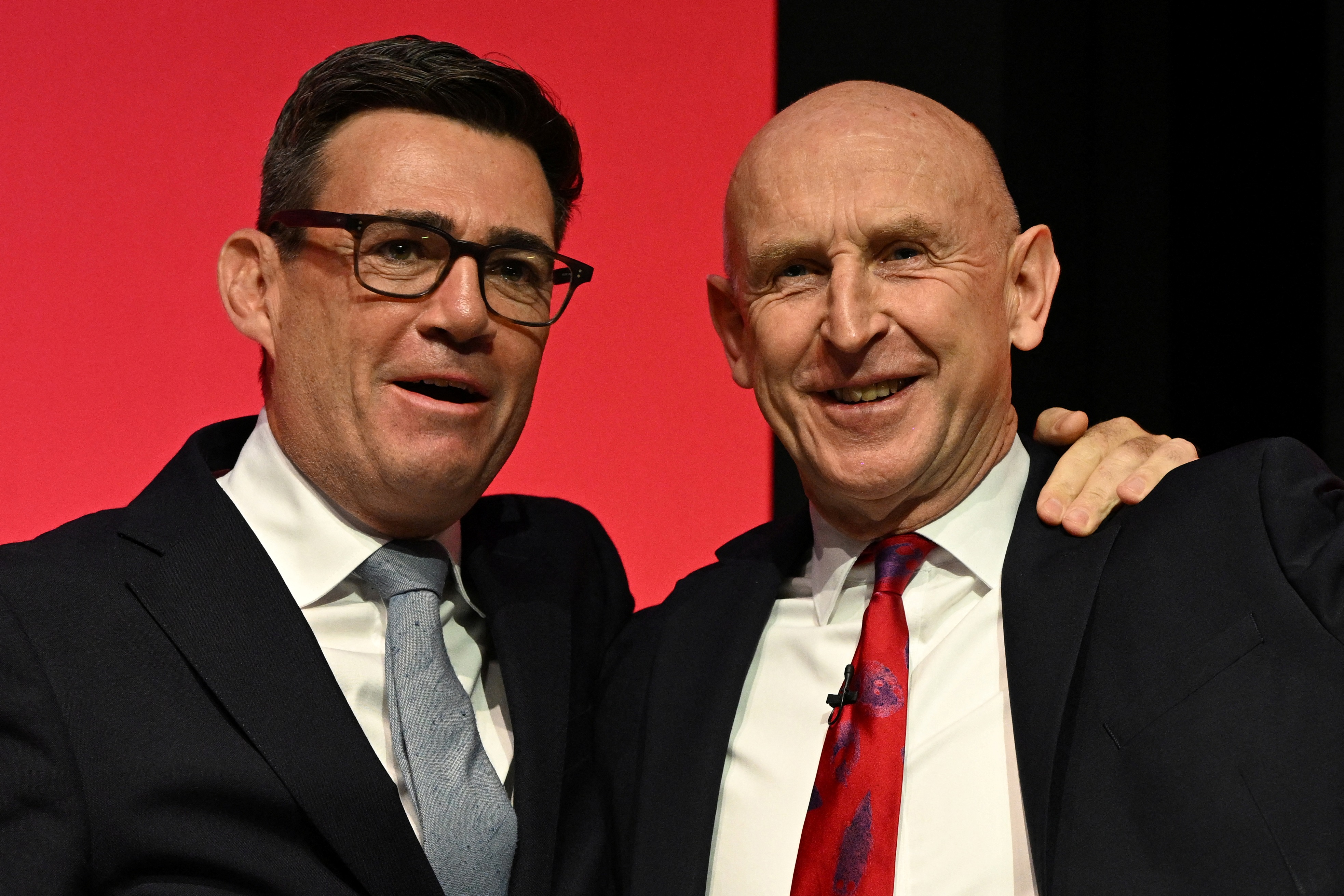 (FILES) Britain's Prime Minister Andy Burnham (L) congratulates Britain's Chancellor of the Exchequer John Healey after he delivered a speech on the second day of the annual Labour Party conference in Liverpool, north-west England, on September 28, 2026.
