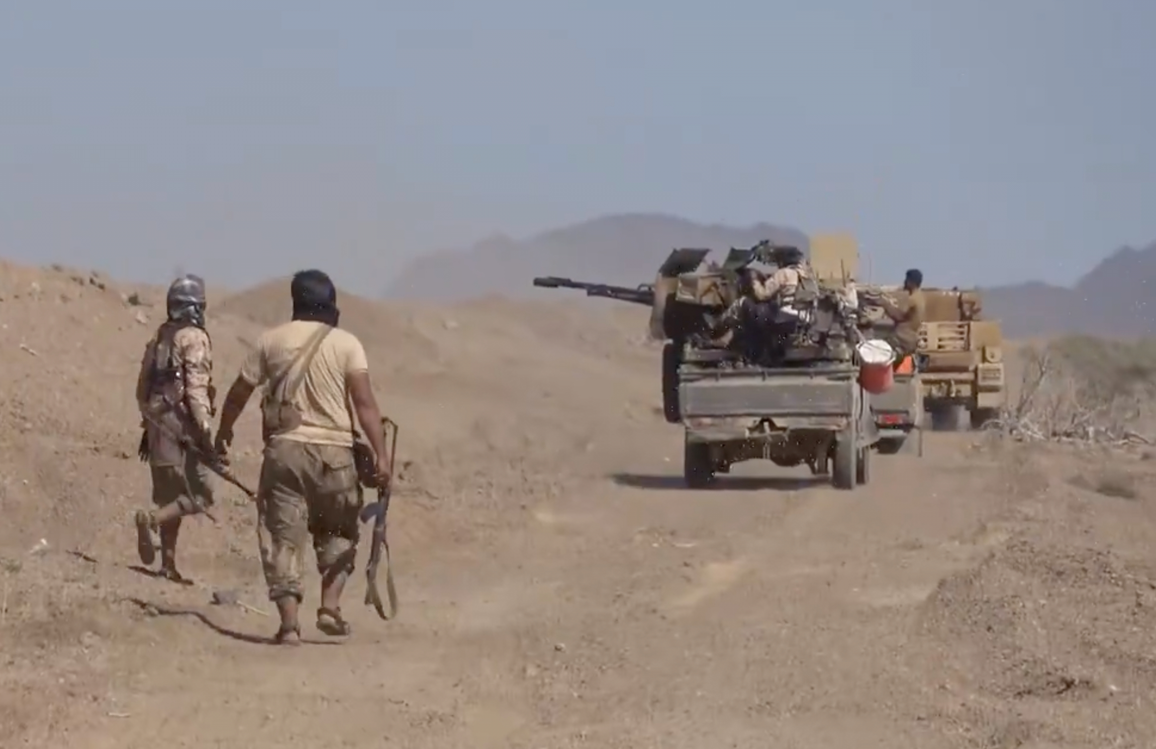 This image taken from undated video released Monday, Oct. 5, 2026, by the Yemeni government-allied Southern Giants Brigades media office shows, what the group says, are its fighters advancing with a pickup truck mounted with a heavy weapon during clashes with the Iran-backed Houthi group in Dhobab district, Taiz, Yemen. (Southern Giants Brigades Media Office via AP)