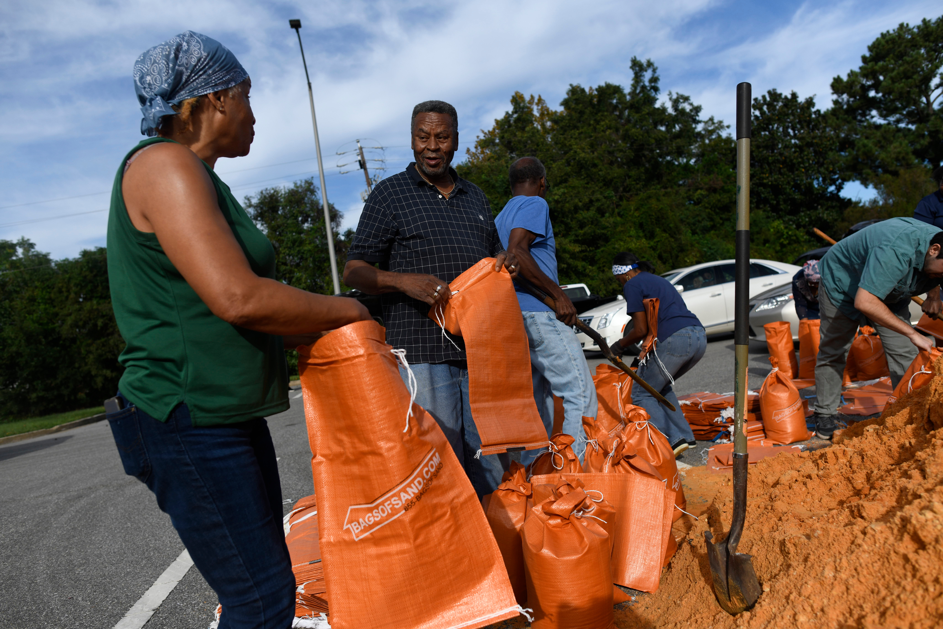 Residents pick up sandbags for storm preparation at the James Seals Jr. Parks & Recreation Center ahead of Hurricane Isaias' expected landfall along the Gulf Coast, Thursday, October 8, 2026, in Mobile, Alabama (AP Photo/Octavio Jones)