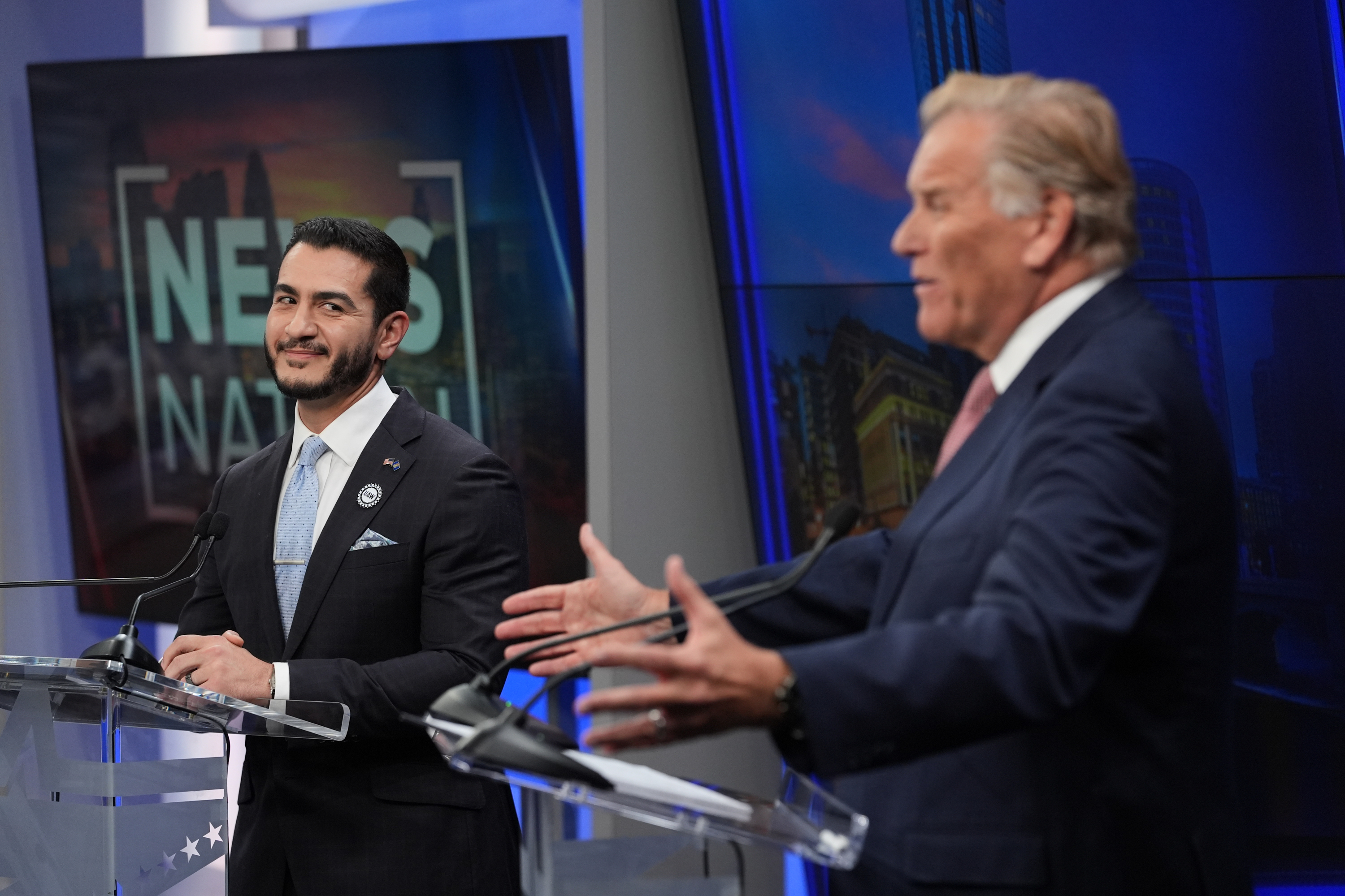 Republican nominee for U.S. Senate Mike Rogers, right, speaks during a televised debate with Democratic nominee for U.S. Senate Abdul El-Sayed, at WOOD-TV, on Thursday, Oct. 8, 2026, in Grand Rapids, Mich. (AP Photo/Paul Sancya, Pool)