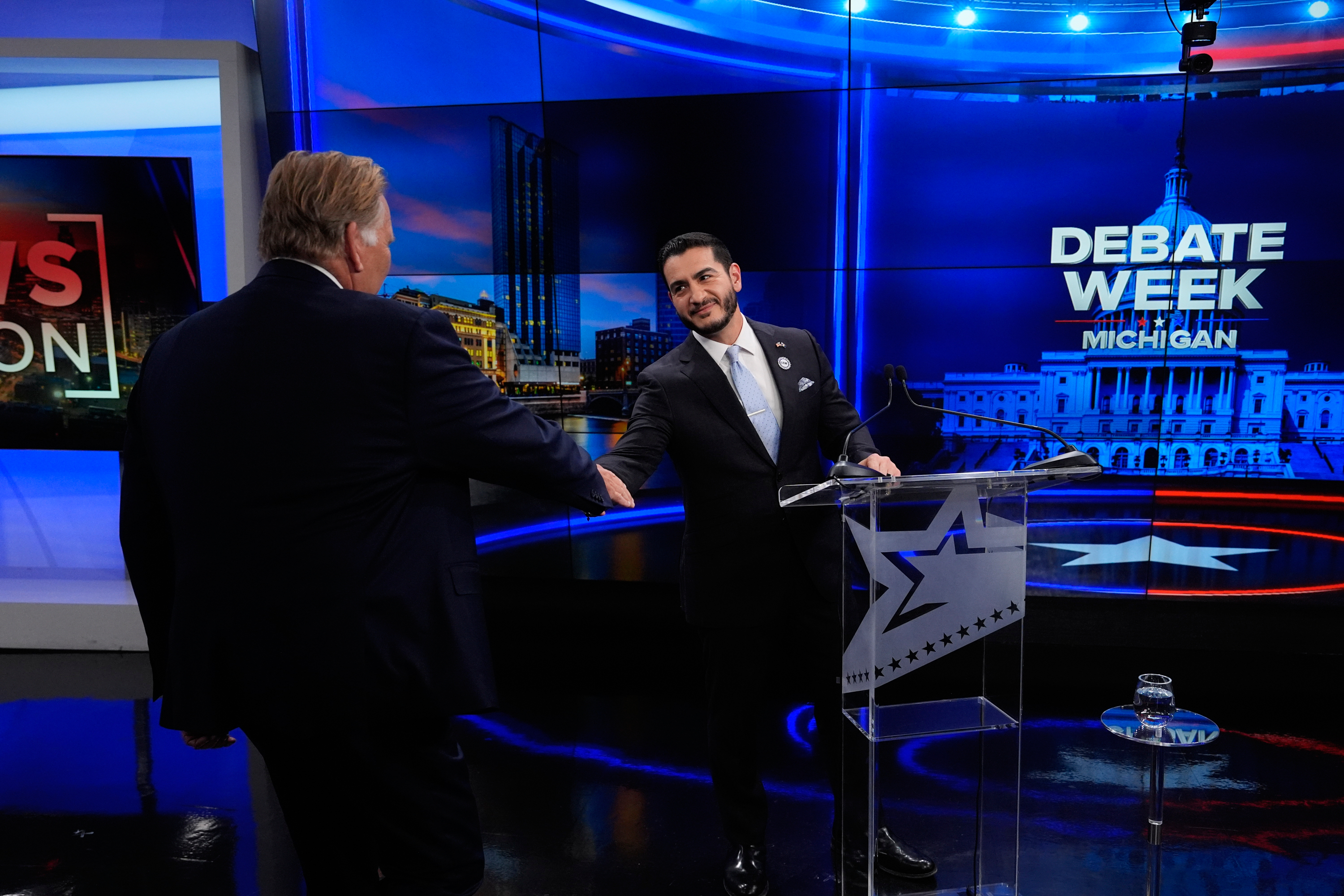 Democratic nominee for U.S. Senate Abdul El-Sayed, right, greets Republican nominee for U.S. Senate Mike Rogers prior to a televised debate at WOOD-TV, on Thursday, Oct. 8, 2026, in Grand Rapids, Mich. (AP Photo/Paul Sancya, Pool)