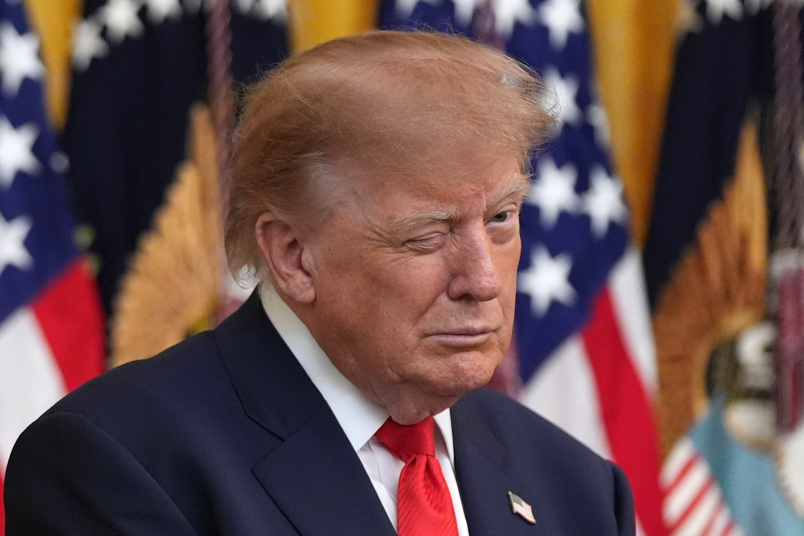 President Donald Trump winks during a Columbus Day celebration in the East Room of the White House, Friday, Oct. 9, 2026, in Washington. (AP Photo/Alex Brandon)