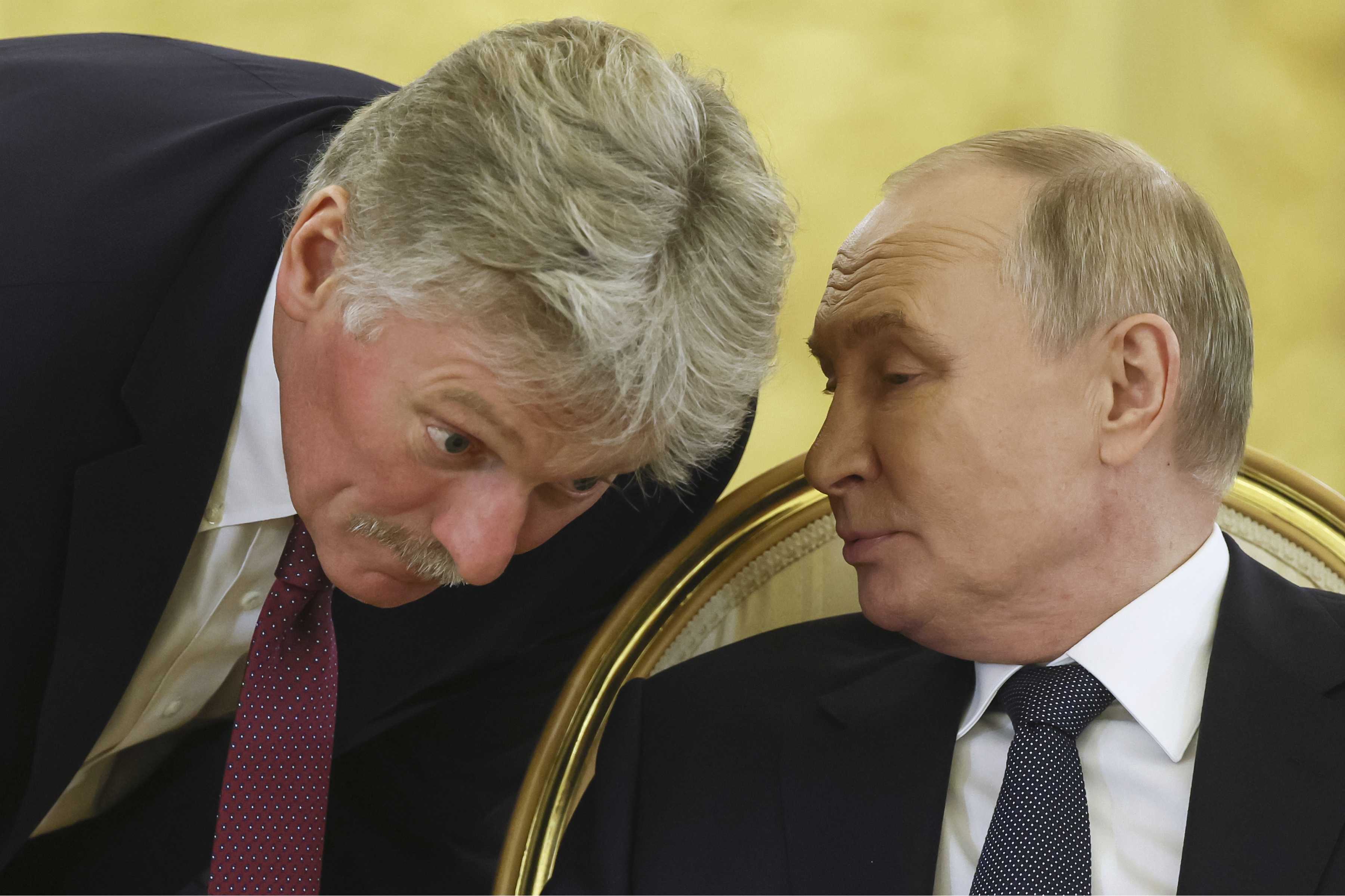 Russian President Vladimir Putin, right, speaks with Kremlin spokesman Dmitry Peskov during an extended meeting at the summit of the heads of state of the Commonwealth of Independent States (CIS) at the Kremlin in Moscow, Russia, Tuesday, Oct. 8, 2024. (Sergei Ilnitsky/Pool Photo via AP)