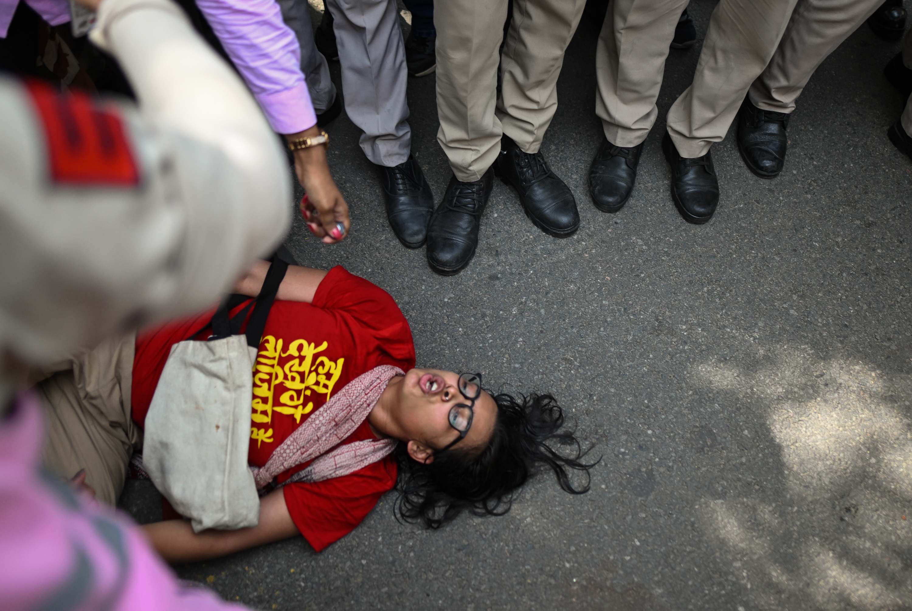 Neha Bora shouts slogans after being detained by police during a protest against India’s Chief Election Commissioner Gyanesh Kumar on October 2, 2026 in New Delhi, India
