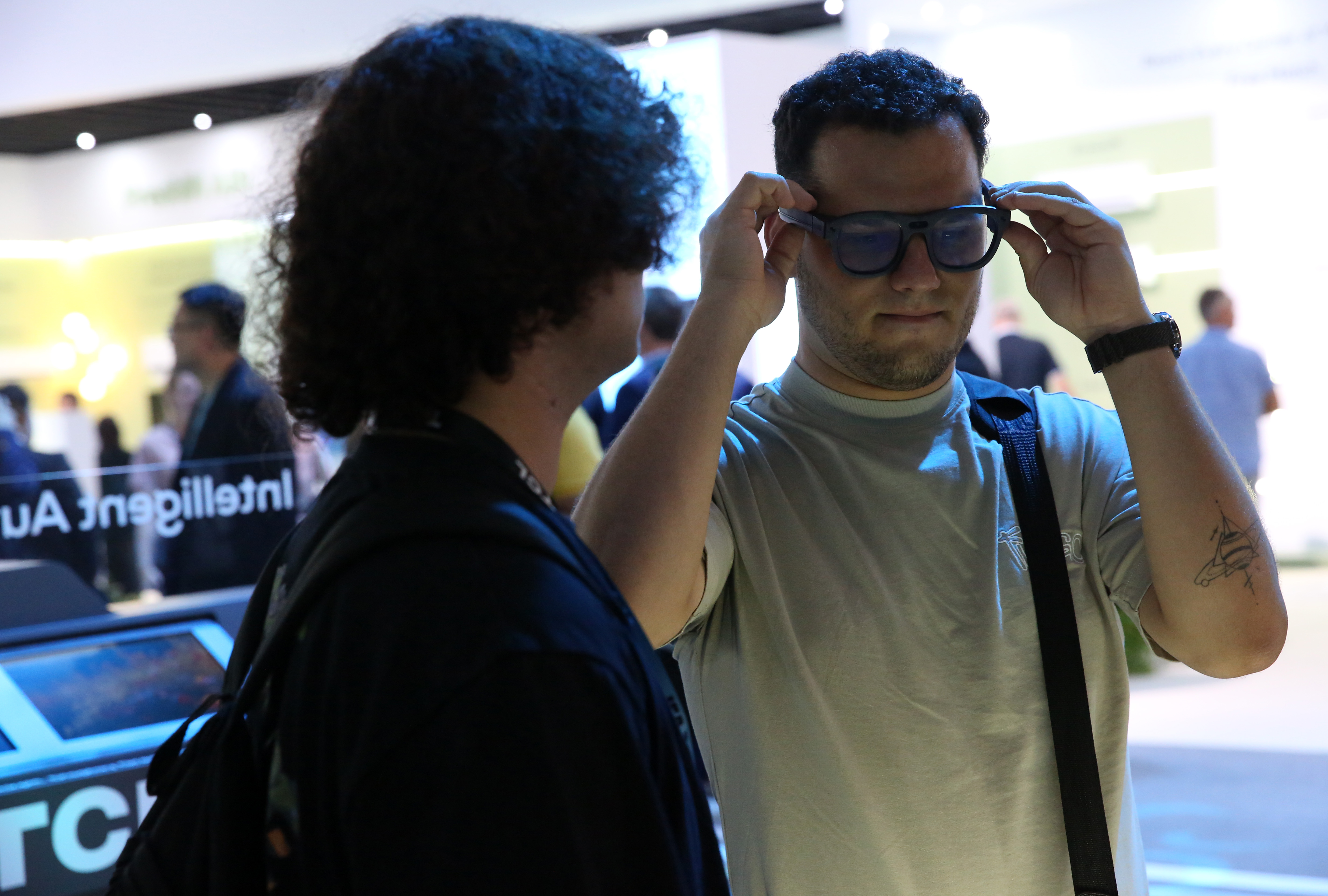 BERLIN, GERMANY - SEPTEMBER 06: A visitor tries out RayNeo X2 augmented reality glasses at the Internationale Funkausstellung Berlin (IFA) international trade fair for consumer electronics and home appliances during the show's 100th anniversary, on September 06, 2024 in Berlin, Germany. The event, which rebranded its acronym name for the occasion to stand for "Innovation für Alle" or "Innovation for All" for the anniversary, its 63rd edition, takes place from September 6-10, 2024. (Photo by Adam Berry/Getty Images)
