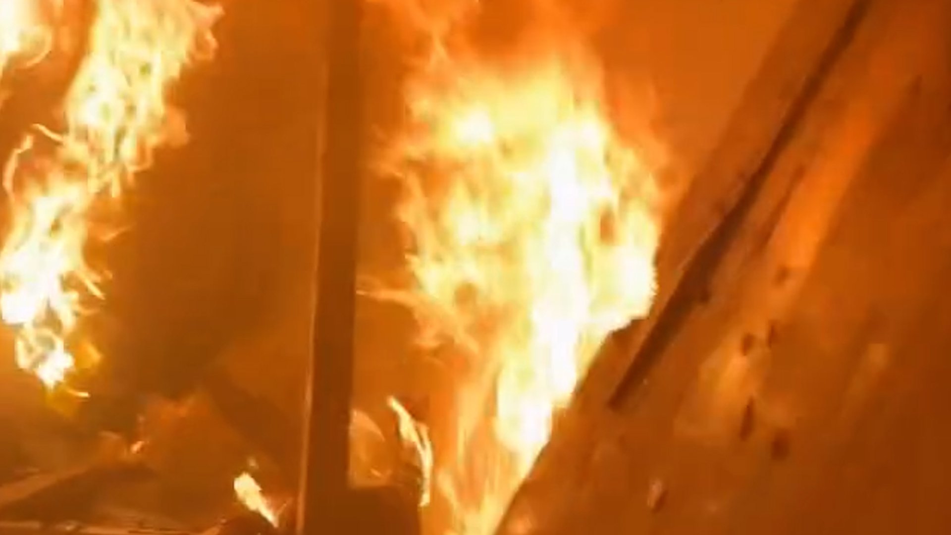 Flames from a burning apartment in Gaza