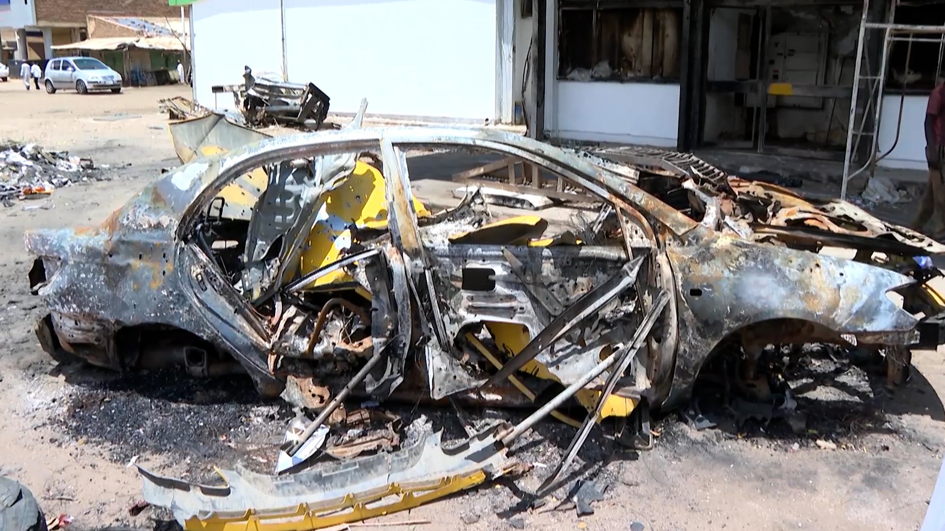 damaged car after drone attack in Sudan