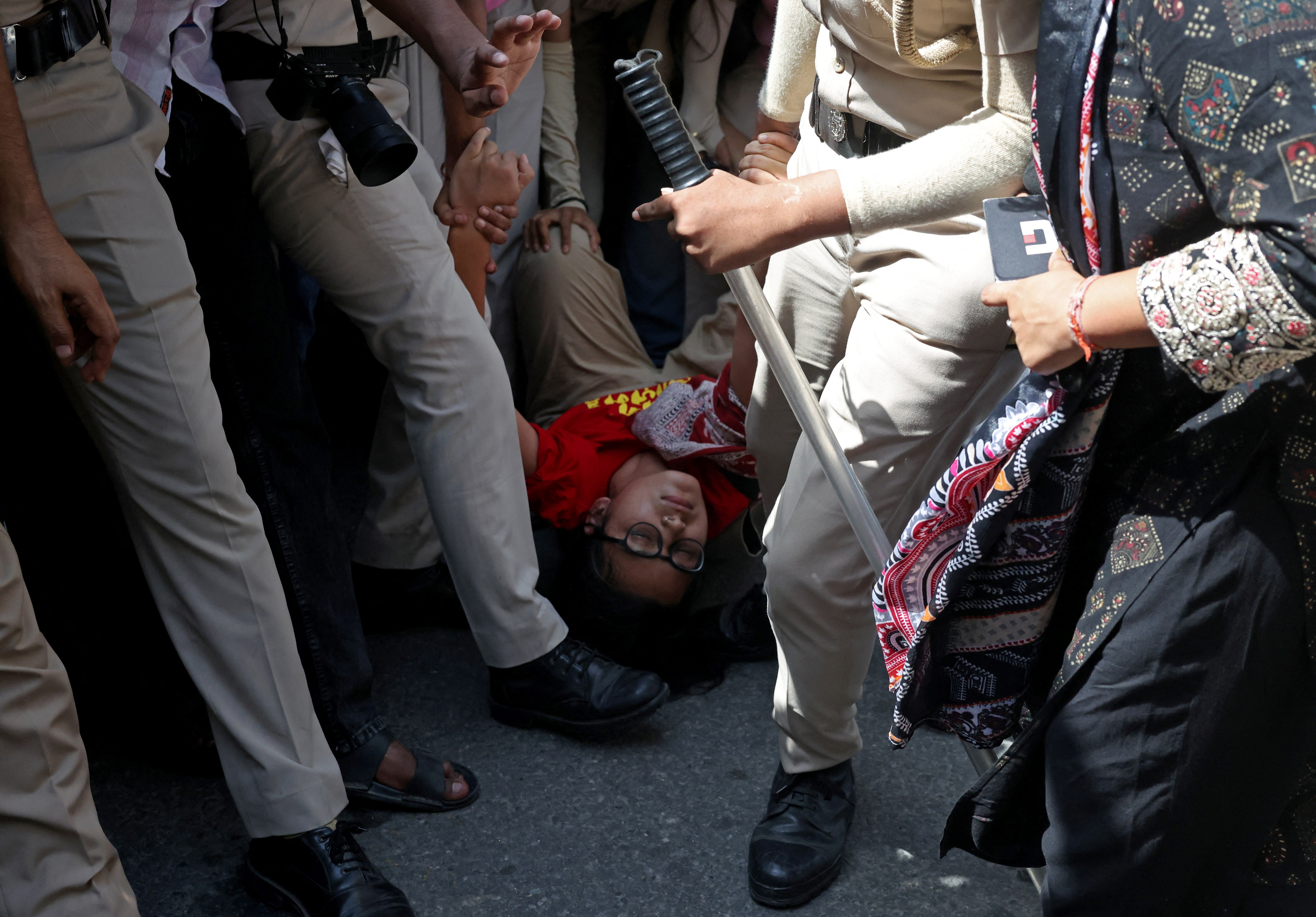 Neha Bora, National President of the All India Students' Association (AISA), is detained by police during a protest demanding the resignation of India's Chief Election Commissioner Gyanesh Kumar, in New Delhi, India, October 2, 2026. REUTERS/Bhawika Chhabra