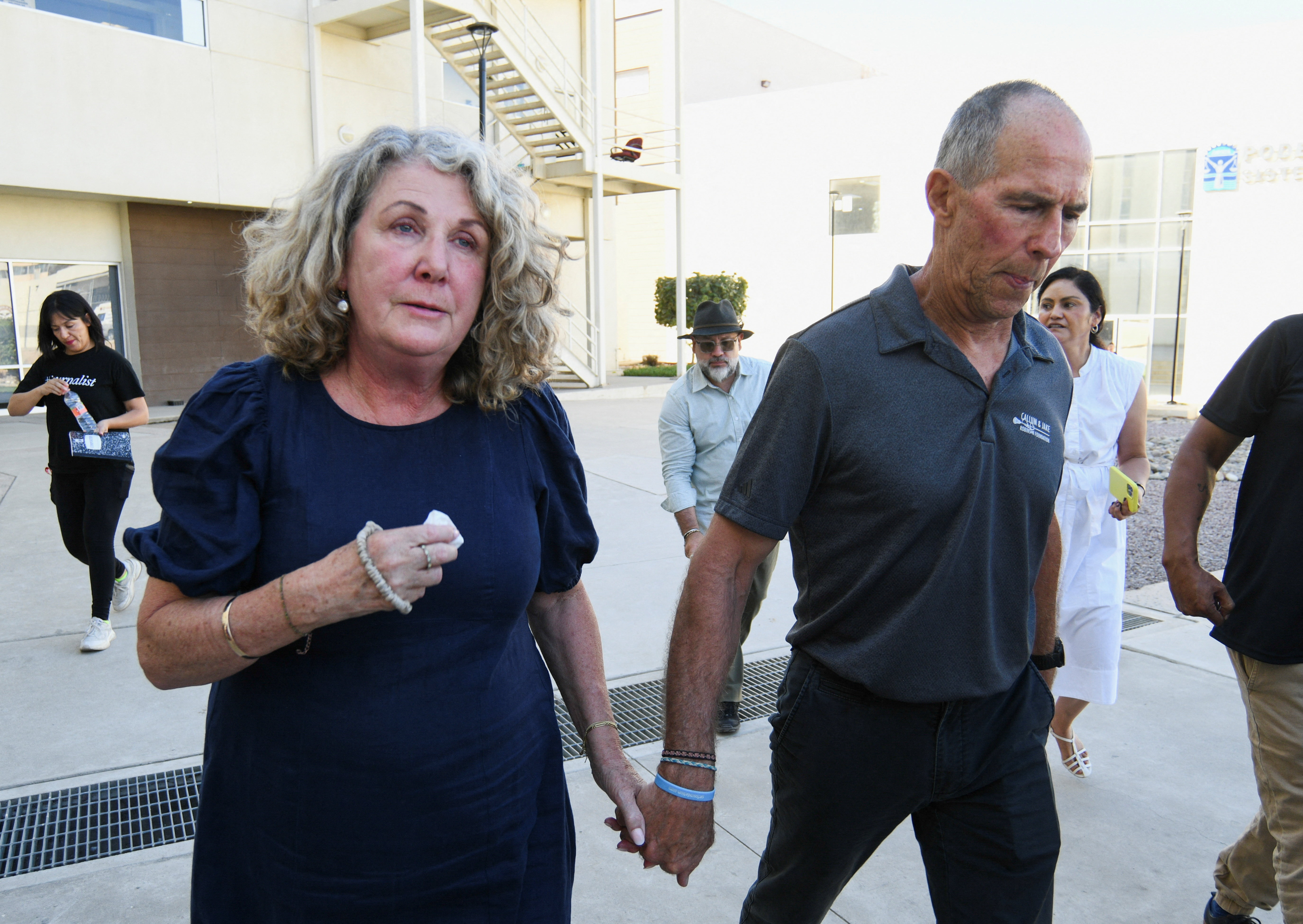 Martin and Debra Robinson, parents of Australian brothers Callum and Jake Robinson, who were killed during a surfing trip in April 2024, leave the Baja California State Palace of Justice after a Mexican judge found three men guilty of the murders of their sons and their American friend Jack Carter Rhoad, in Ensenada, Mexico, October 9, 2026. REUTERS/Enrique Botello