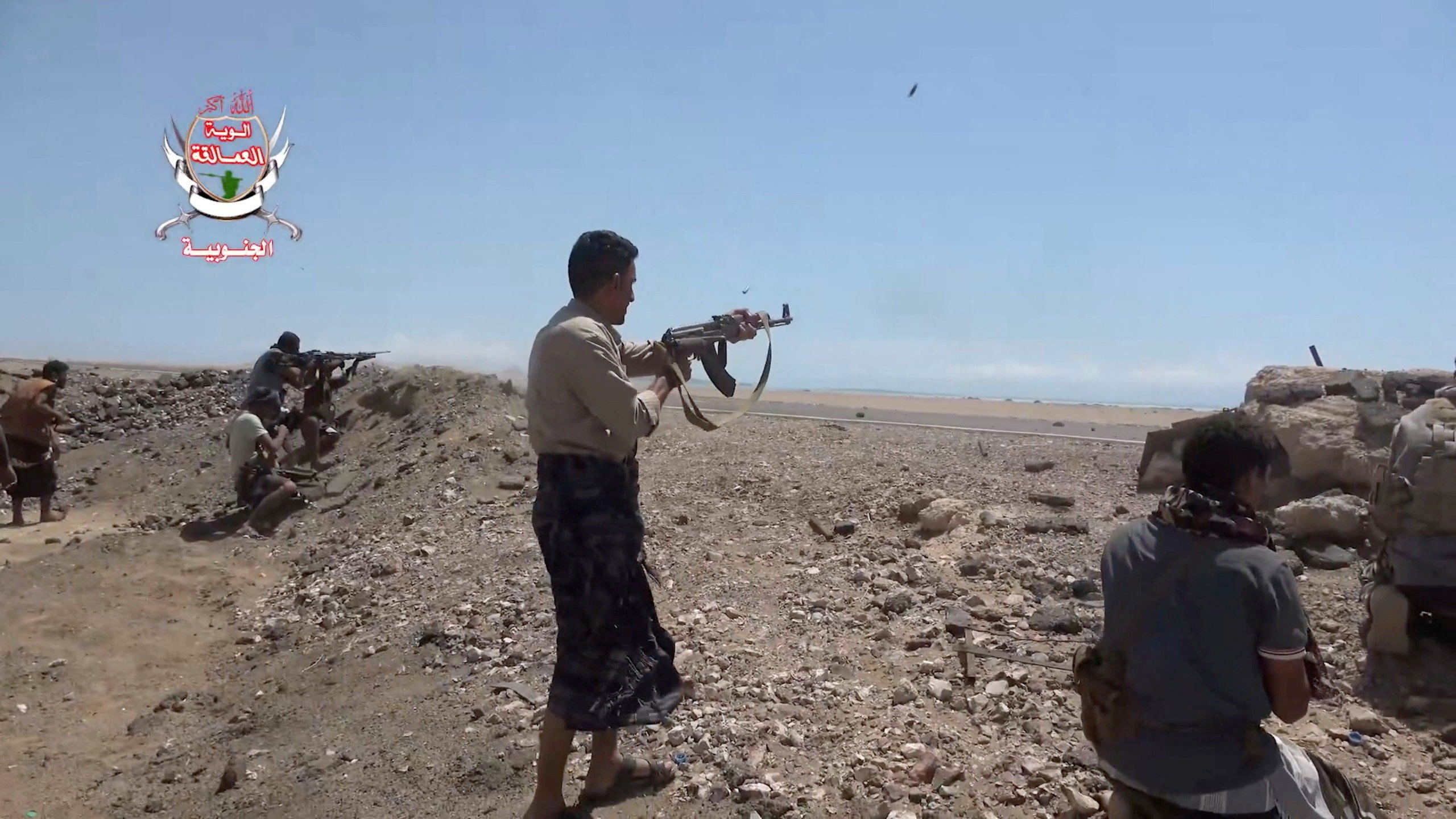 Pro-Saudi-backed Yemeni government fighters fire their weapons during what government forces say was an advance against the Iran-backed Houthis, near Dhubab, Taiz Governorate, Yemen, in this still image taken from video released October 5, 2026. Southern Giants Brigades/Handout via REUTERS THIS IMAGE HAS BEEN SUPPLIED BY A THIRD PARTY. MUST NOT OBSCURE LOGO. VERIFICATION: - Location partially verified from the runway, airport control tower, road layout, shape of the mountains and coastline, that matched topography mapping, satellite and archive imagery. - Date could not be independently verified. - No older versions found posted online before October 5.