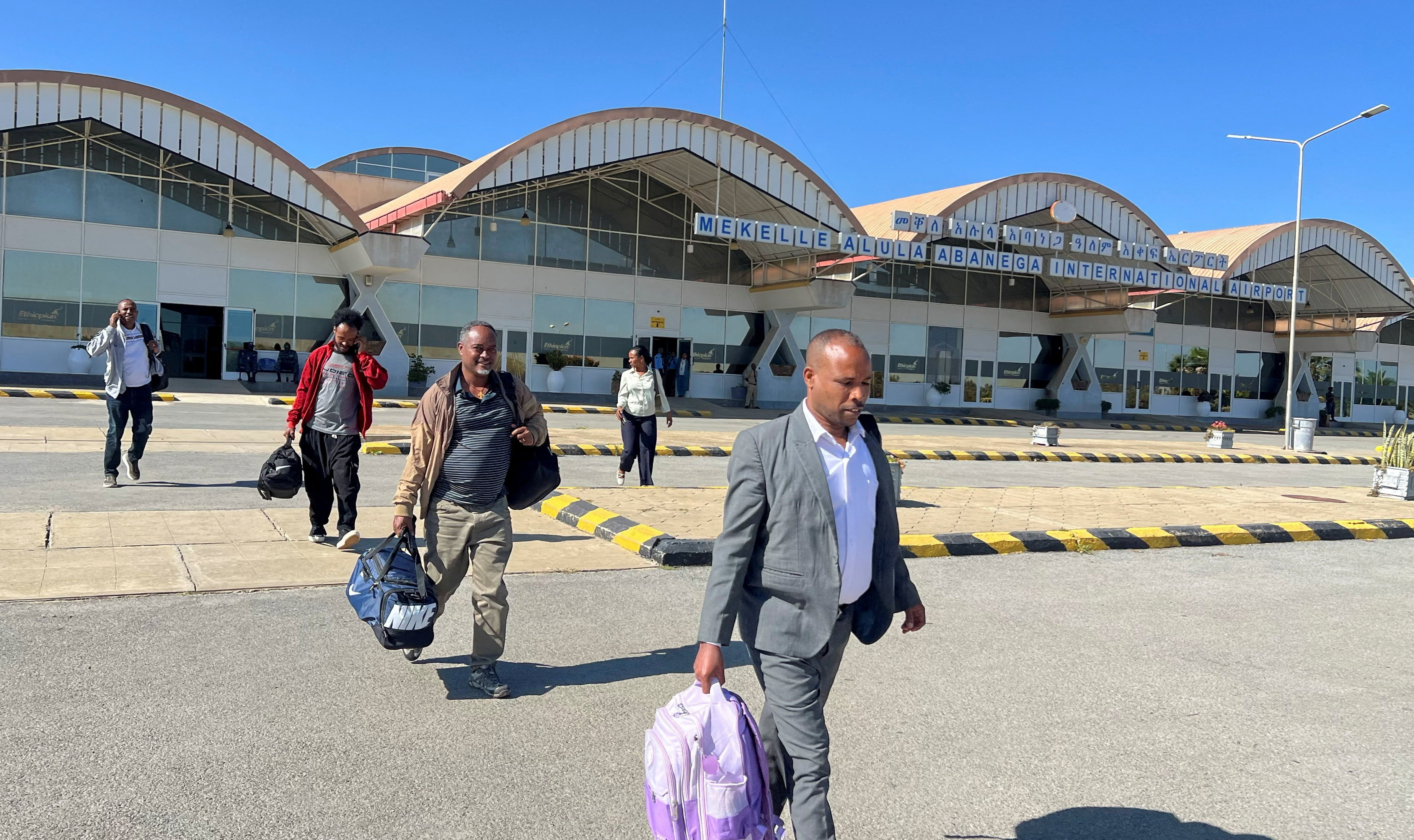 Passengers walk from the terminal after arriving at the Mekelle Alula Abanega International Airport after Ethiopian Airlines resume flight to Mekelle, Tigray Region, Ethiopia, October 11, 2026. Picture taken with a mobile phone. Obtained by REUTERS TPX IMAGES OF THE DAY