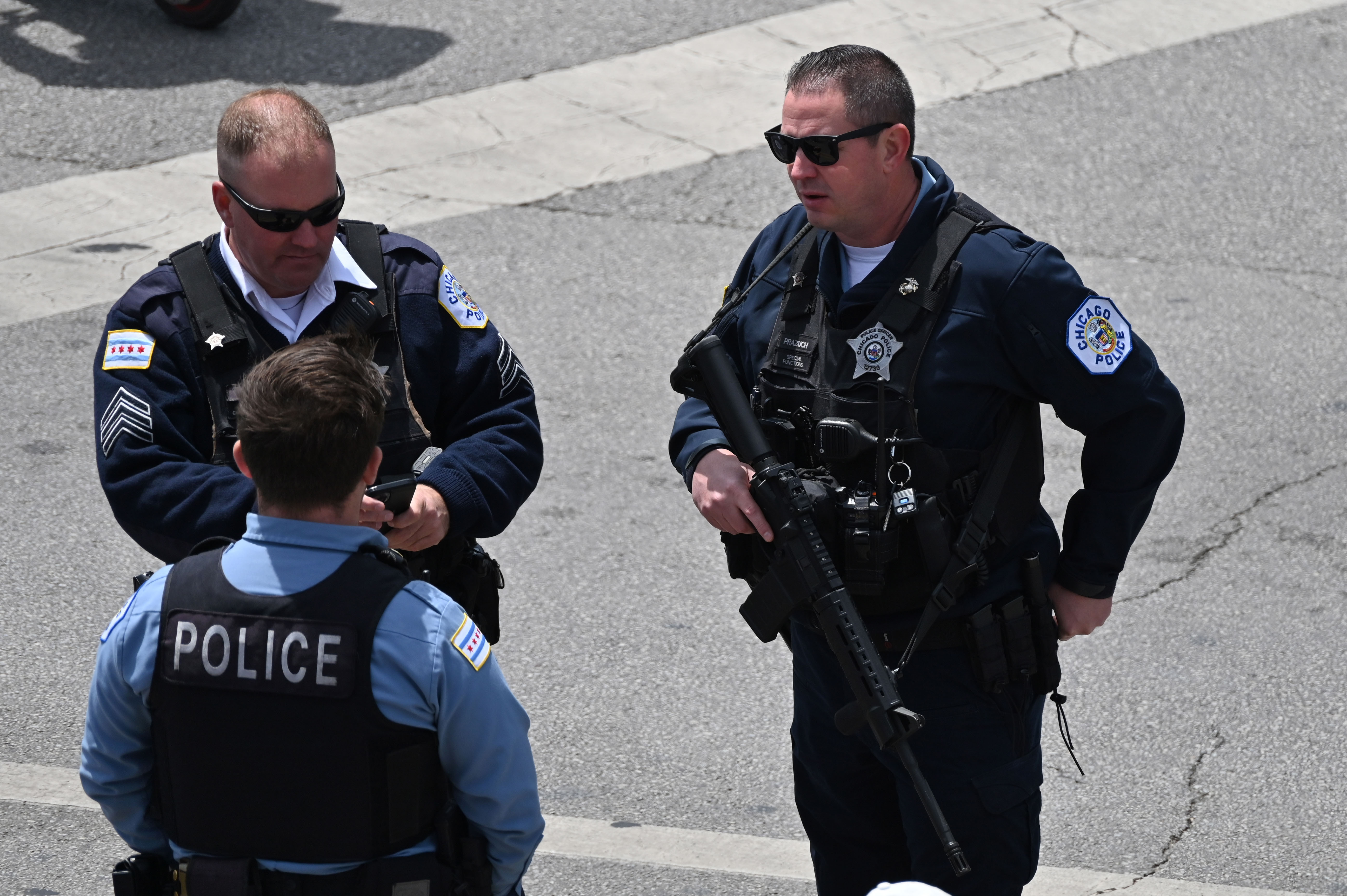 May 26, 2025; Chicago, Illinois, USA; Chicago Police are seen outside prior to game between the Chicago Cubs and the Colorado Rockies at Wrigley Field. Mandatory Credit: Patrick Gorski-Imagn Images