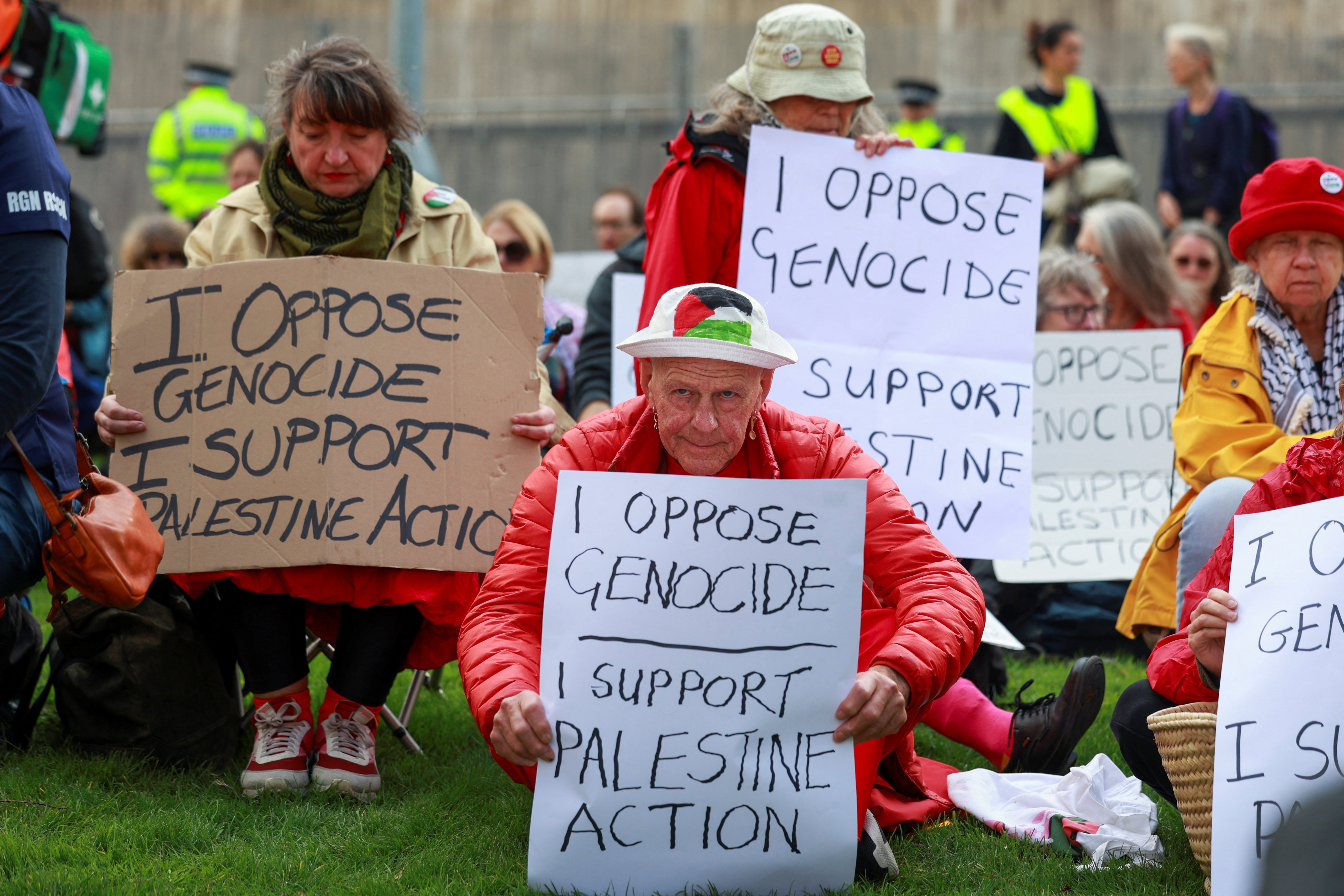 Campaigners from the Palestine Action Group hold signs during a protest outside the venue of the Labour Party’s annual conference in Liverpool, Britain, September 27, 2026. REUTERS/Temilade Adelaja