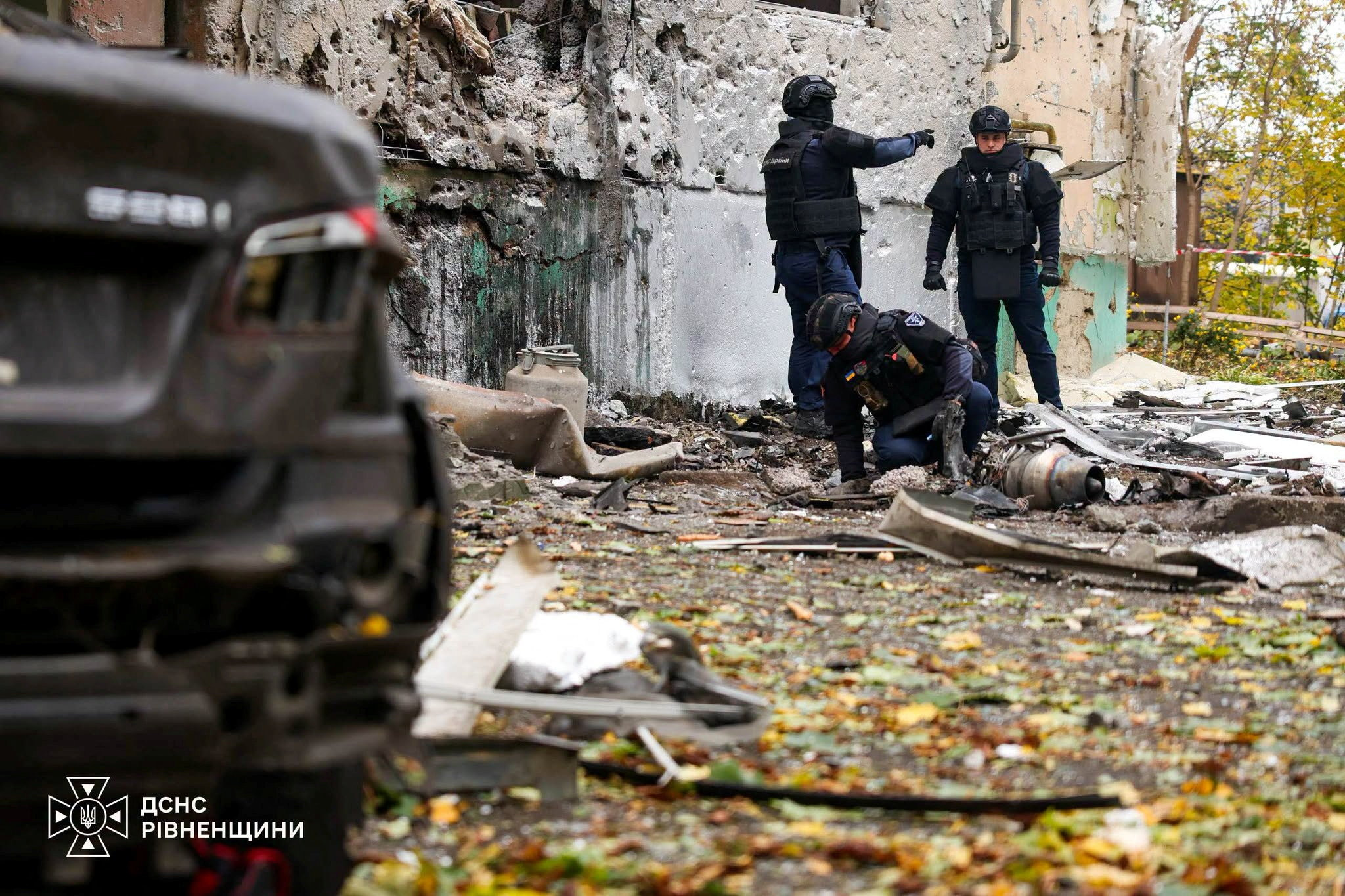 Emergency service deminers work at the site of an apartment building damaged during a Russian drone strike in the Rivne region, Ukraine, on October 16, 2026.
