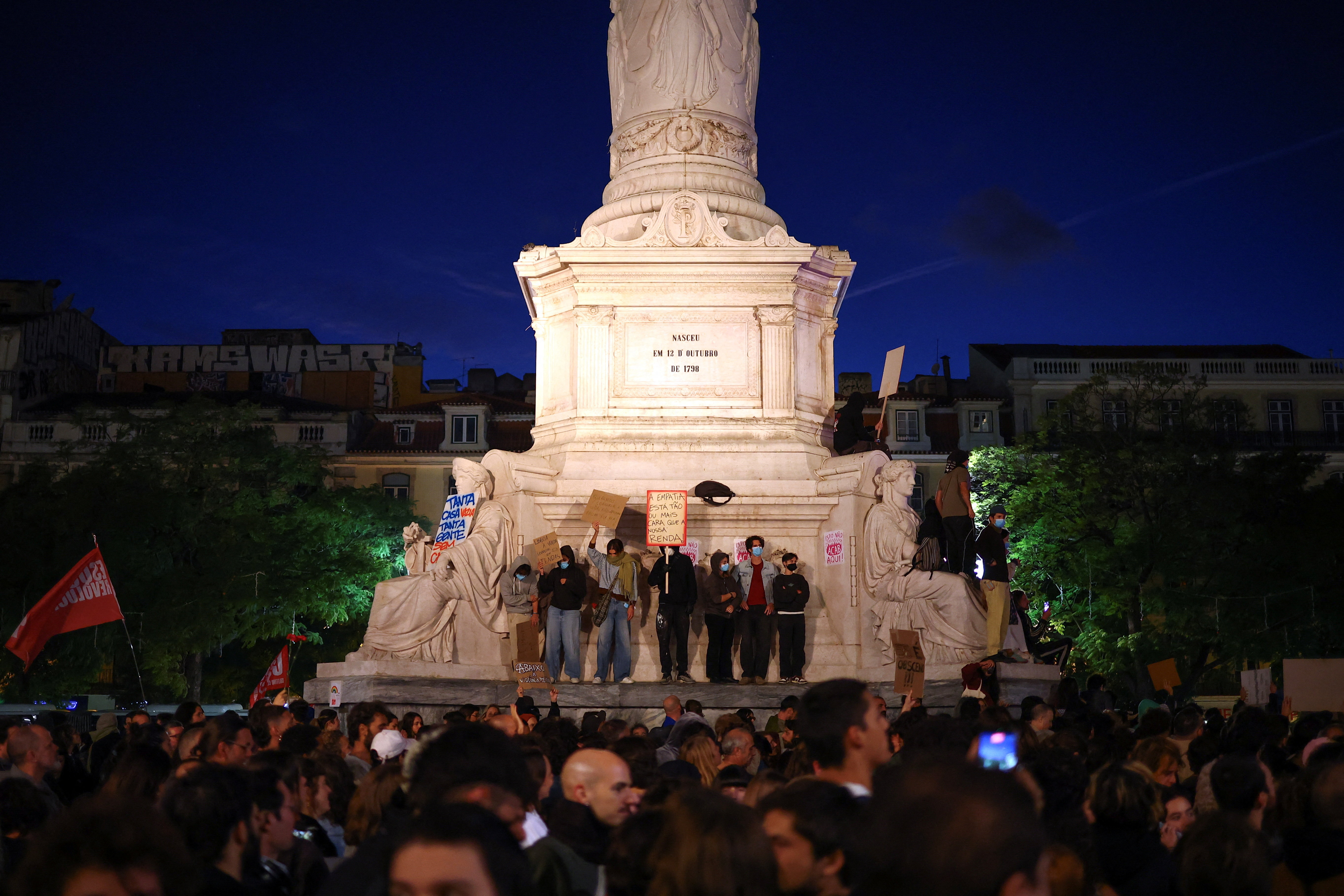 People gather to protest in Rossio Square against the housing crisis and cost of living in Lisbon, Portugal, on October 20, 2026.