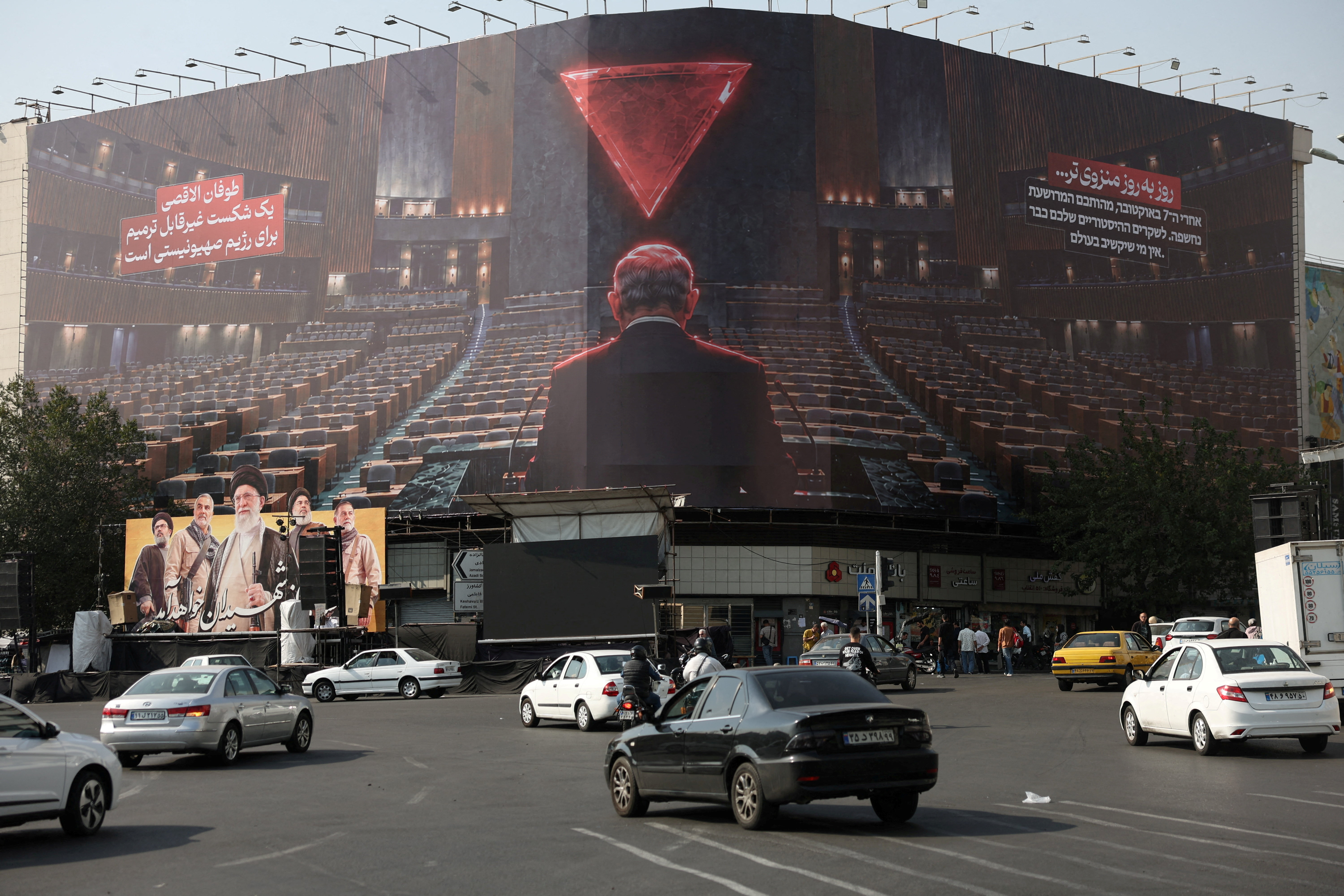 A billboard depicting Israeli Prime Minister Benjamin Netanyahu in the empty hall of the United Nations, on a building in Tehran, Iran, October 13, 2026. Majid Asgaripour/WANA (West Asia News Agency) via REUTERS ATTENTION EDITORS - THIS PICTURE WAS PROVIDED BY A THIRD PARTY. ISRAEL OUT. NO COMMERCIAL OR EDITORIAL SALES IN ISRAEL. NO ACCESS FOR ISRAELI MEDIA. NO USE BBC PERSIAN. NO USE VOA PERSIAN. NO USE MANOTO. NO USE IRAN INTERNATIONAL. NO USE RADIO FARDA. DIGITAL: NO USE BBC PERSIAN. NO USE VOA PERSIAN. NO USE MANOTO. NO USE IRAN INTERNATIONAL. NO USE RADIO FARDA./File Photo