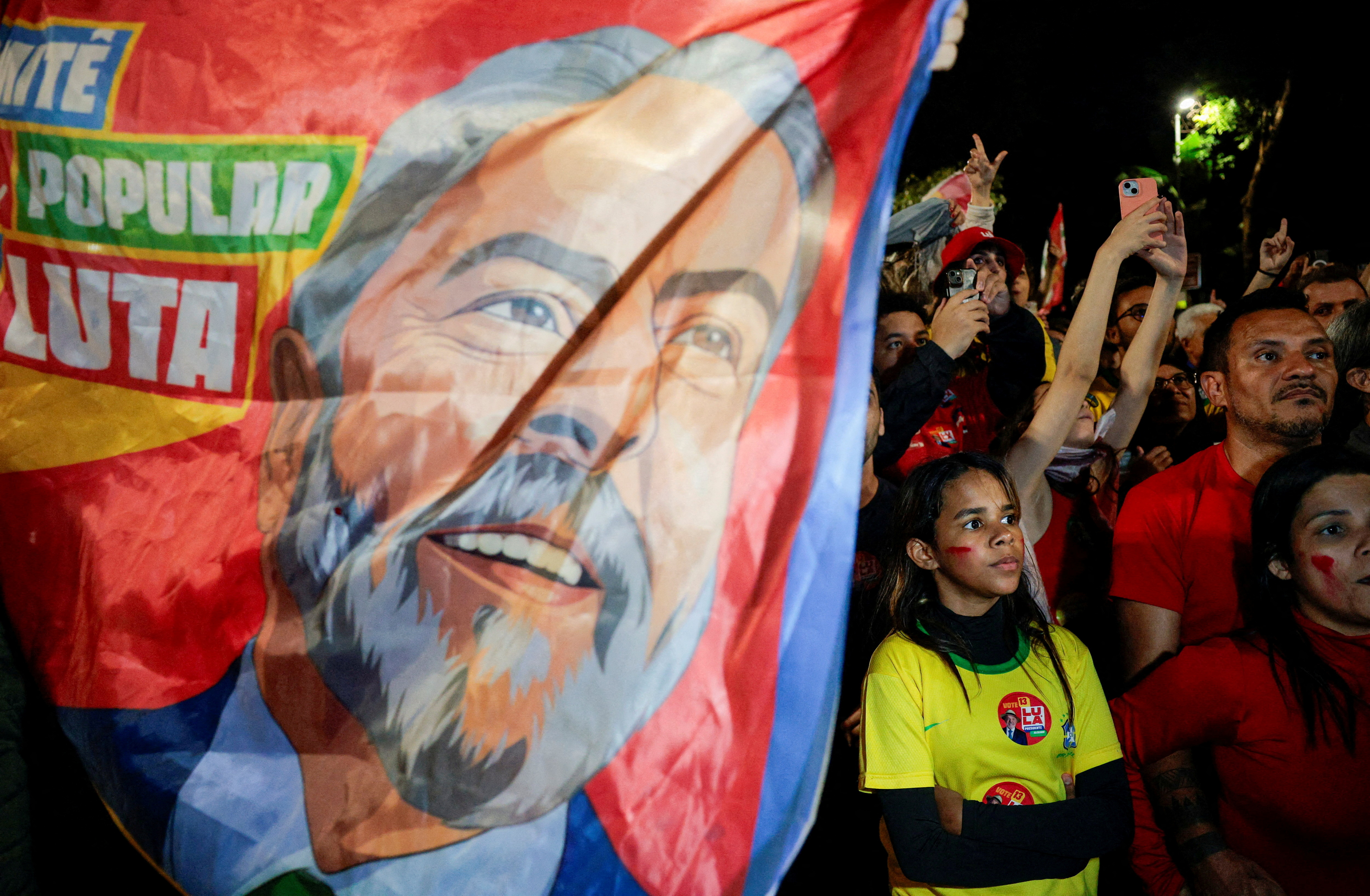 FILE PHOTO: Supporters gather to watch Brazil's President Luiz Inacio Lula da Silva, the Workers' Party (PT) candidate for re-election, speak after his victory in the presidential runoff election, at Paulista Avenue, in Sao Paulo, Brazil, October 25, 2026. REUTERS/Brian Snyder/File Photo