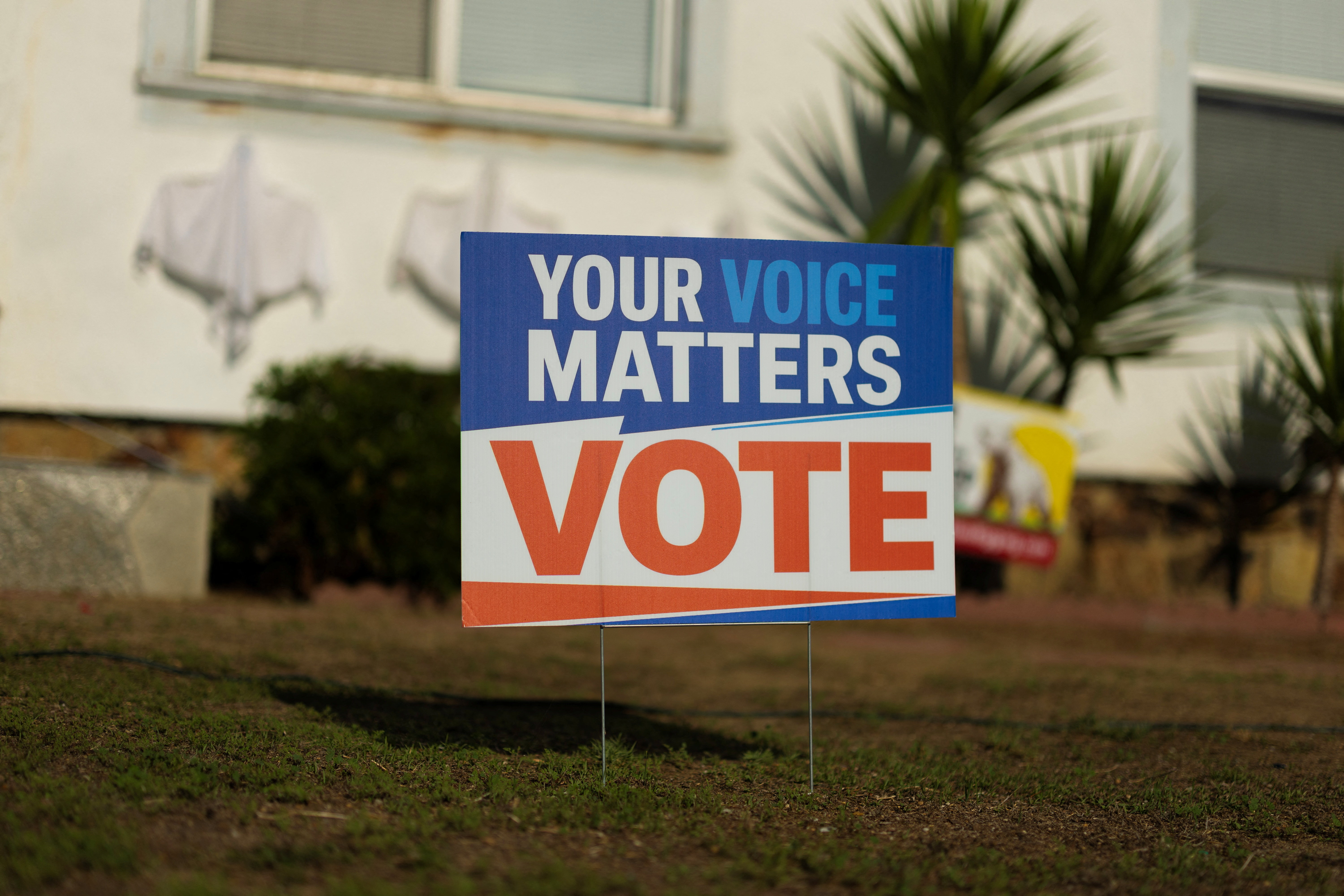 An election sign encouraging people to vote is displayed in the front yard of a residential home in Encinitas, California, US, October 21, 2026. REUTERS/Mike Blake